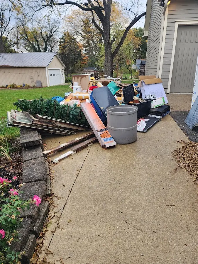 Dumpster being loaded with debris for 3 Yard Dumpster Rental in East Manchester